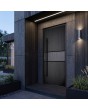 Black front door with milled geometric patterns
